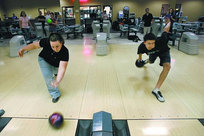 Chad Lundquist/Nevada AppealMeaghan Wass, 22, and Morgan Dickens, 19, practice at the Gold Dust West Bowling Center on Wednesday.