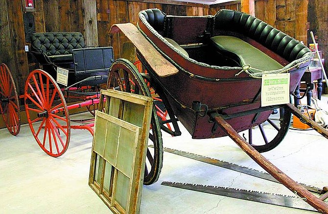 Jonni Hill/Nevada Appeal News Service Restored planks from the Exchequer Mill serve as a backdrop to an Irish cart in the new carriage house exhibit at the Alpine County Museum.