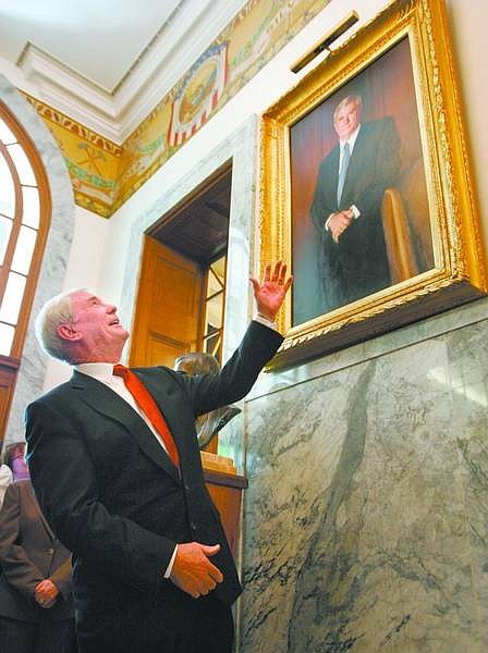 Former Nevada Gov. Kenny Guinn unveiled his official portrait during a reception held on Tuesday at the Capitol in Carson City.   Cathleen Allison /Nevada Appeal