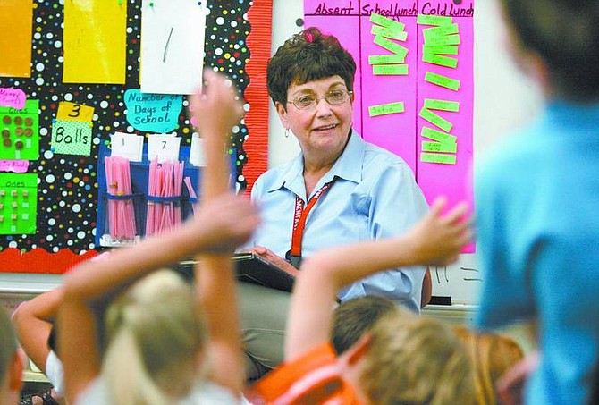 Cathleen Allison/Nevada Appeal Mary Kay Kinne talks with her first-grade class Friday morning at Fritsch Elementary School. Kinne will retire this month after 25 years of teaching.