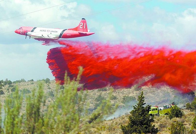Brad Horn/Nevada Appeal An airtanker drops slurry on the Sedge Fire in the Brunswick Canyon bridge area on the east side of Carson City on Wednesday. The fire burned 10 acres and was 100 percent contained by 5 p.m.