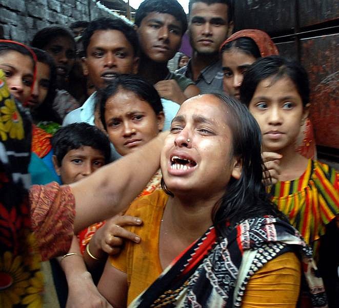 A Bangladeshi mother mourns after she lost her child in Chittagong, 135 miles southeast of Dhaka on Monday. At least 67 people were killed and many others were injured Monday in mudslides triggered by heavy monsoon rains in a hilly port city in southeastern Bangladesh, rescue officials and witnesses said.   Mobark Hossain/ Associated Press