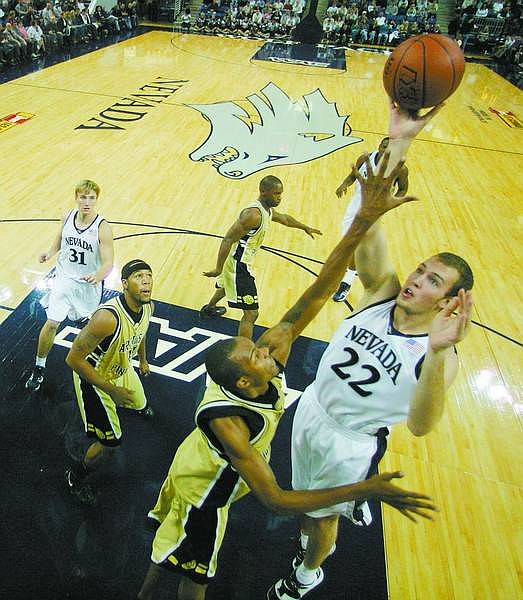 APPEALFILEPHOTO/BRADHORN Nevada&#039;s Nick Fazekas scores over an Arkansas-Pine Bluff defender during a Wolf Pack game back in November. Fazekas, the two-time All American, worked out with Philadelphia Tuesday.