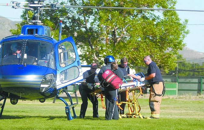 Kevin Clifford/Nevada Appeal  A 9-year-old boy from the Boys &amp; Girls Club was injured Friday afternoon when a change machine toppled over onto him. The boy was taken to Renown Regional Medical Center in Reno by a Care Flight helicopter.