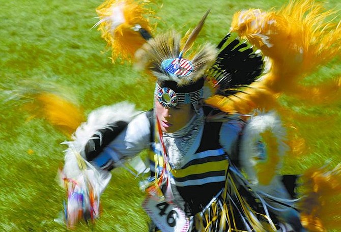 Kevin Clifford/Nevada Appeal Jared Jackson, 13, of Medford, Ore., competes during the Stewart Father&#039;s Day Powwow Saturday afternoon in Carson City. The powwow continues today at Stewart Indian School.