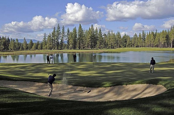 Rod Hanna/Golf the High Sierra Members of a media tour play the 13th hole at The Golf Club at Grays Crossing in Truckee, Calif., on June 6.