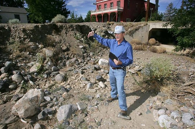 Cathleen Allison/Nevada Appeal  Lyon County Engineer Dick Faber talks Tuesday morning about the work needed to shore up Gold Canyon Creek. High-water years mean trouble for nearby property owners and historic structures.