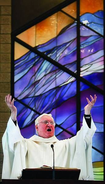 Chad Lundquist/Nevada Appeal The Rev. Jerry Hanley, 71, speaks with enthusiasm during his last sermon on Sunday at St. Teresa of Avila Catholic Church. Hanley is retiring from St. Teresa of Avila after 30 years of service.