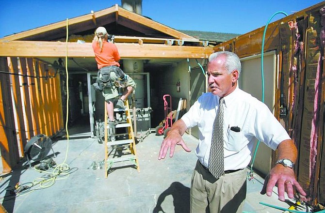 Cathleen Allison/Nevada Appeal FitzHenry&#039;s Funeral Home and Crematory funeral director Jim Smolenski talks Thursday about the renovations under way that will allow the company to offer more options and peace of mind to grieving families.