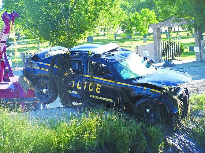 Crews extract a Fallon Paiute-Shoshone tribal police car Wednesday morning from a canal off of Rio Vista Drive. Officer Adam Menuez, 27, died after he lost control of his vehicle while responding to a medical emergency.  Courtesy of Trooper Chuck Allen/Nevada Highway Patrol