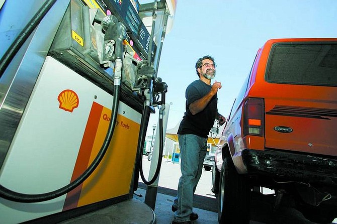 BRAD HORN/Nevada Appeal Sergio Talvera, who was first in line to get gas, gives a thumbs up after receiving 25 gallons of free gas at Bob&#039;s Shell on Carson Street on Wednesday.