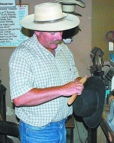 Photos by Steve Ranson/Nevada Appeal News Service Bud Openshaw of Openshaw Saddlery in Fallon reshapes and fixes hats. He said cowboy hats haven&#039;t changed much in more than 100 years.