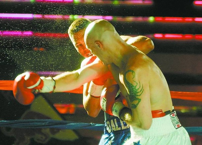 Jesse Brinkley hits Dallas Vargas during their boxing match at the El Dorado Hotel Casino in Reno, Nev., on Friday, July 6, 2007. (AP Photo/Brad Horn, Nevada Appeal)