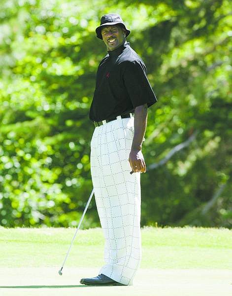 NBA legend Michael Jordan reacts to missing a putt on the 6th green at Edgewood Tahoe Golf Course in Stateline, Nev., during the Celeb-Am Tournament on Thursday, July 12, 2007. (AP Photo/Brad Horn, Nevada Appeal