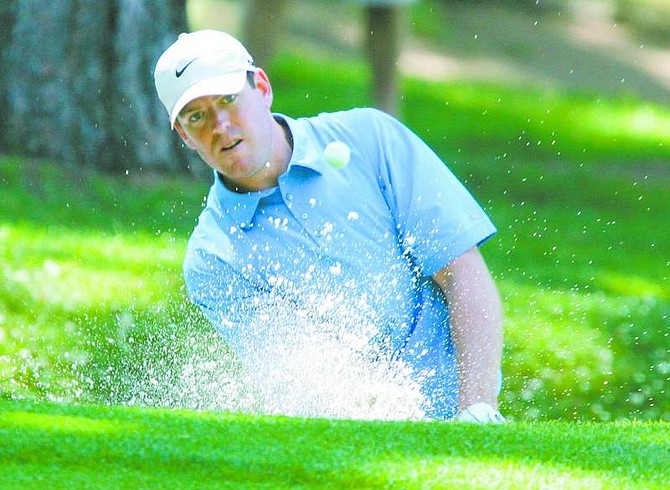 Cincinnati Bengals quarterback Carson Palmer hits out of a sand trap at Edgewood Tahoe Golf Course during the American Century Championship on Friday, July 13, 2007, in Stateline, Nev. (AP Photo/Brad Horn, Nevada Appeal)