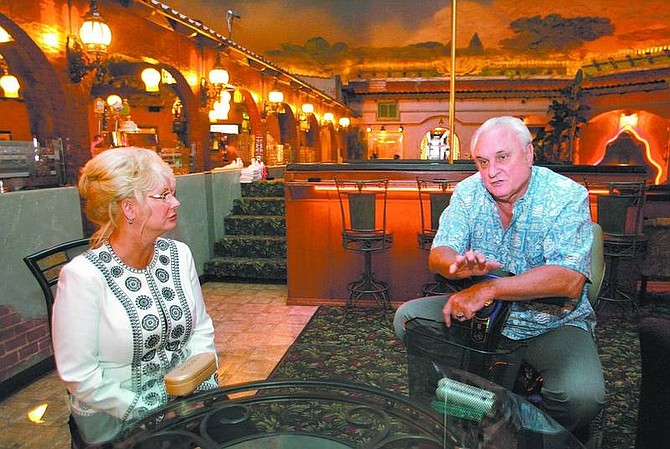 Cathleen Allison/Nevada Appeal Mustang Ranch madam Susan Austin and owner Lance Gilman talk Thursday about the Saturday grand reopening of the Storey County Mustang Ranch brothel. The new facility includes 30,000 square feet of the original buildings restored with an Italian theme and a museum honoring the tradition of original owner Joe Conforte.