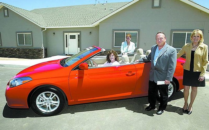 Shannon Litz/The R-C Patty Clark sits in the 2007 Toyota Solara with Austin&#039;s House executive director Pamela Wise, Carson City Toyota general manager Dana Whaley and Austin&#039;s House board member Linda Cuddy at the Carson Valley Children&#039;s Center on Thursday.  The car was donated by the Northern Nevada Toyota Dealers and will be part of the &#039;Deal or No Deal&#039; fundraiser Aug. 25.