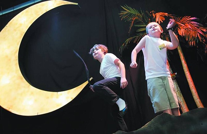 Chad Lundquist/Nevada Appeal Wild Horse Theater members Devlin Munsdeane, left, and Challen Wright rehearse their roles in &quot;The Jungle Book&quot; on Monday at the Children&#039;s Museum of Northern Nevada. The show runs Friday and Saturday and Aug. 3 and 4.