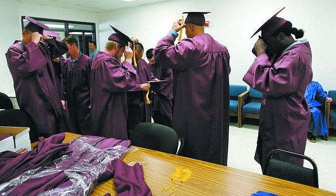 Chad Lundquist/Nevada Appeal Inmates prepare for the graduation ceremony at Northern Nevada Correctional Center on Wednesday. Twenty-two prisoners graduated with degrees from Carson Adult High School and/or Western Nevada College.