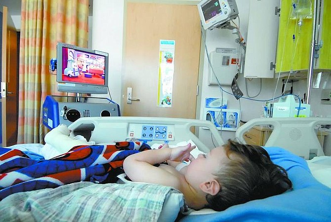Kevin Clifford/Nevada Appeal Liam Spears, 2, watches the movie &quot;Cars&quot; on the Carson Tahoe Regional Medical Center&#039;s new entertainment station for the pediatrics unit on Friday afternoon.