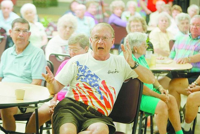 BRAD HORN/Nevada Appeal Dave Campbell asks questions why an American flag was taken down in the dining room at the Carson City Senior Citizen&#039;s Center for a private function at a meeting at the center on Wednesday.