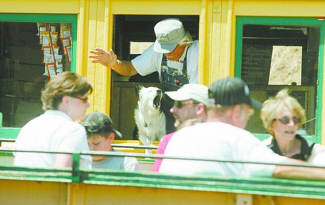 BRAD HORN/Nevada Appeal Jackson, a 2-year-old border collie, greets passengers on the Virginia &amp; Truckee Railroad train as it pulls into the Virginia City station during the Virginia City/Carson City Railfest celebration on Saturday. The dog&#039;s owner Jack Vaughn waves in the background.
