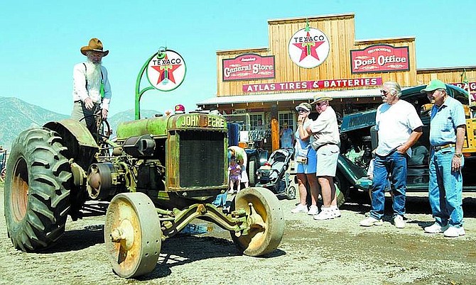 Shannon Litz/Nevada Appeal News Service Visitors watch the parade at last year&#039;s antique tractor show. This year&#039;s event, the 12th, begins 9 a.m. Saturday and 8 a.m. Sunday.