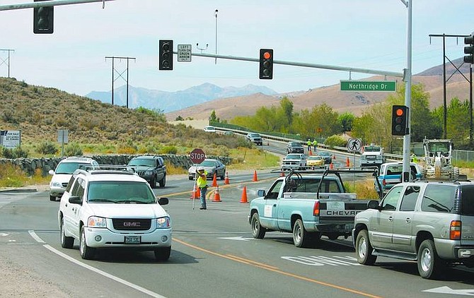Cathleen Allison/Nevada Appeal Crews began work Thursday on North Roop Street, between Winnie Lane and Northridge Drive, to correct a problem with recent resurfacing work. It was reopened later in the day. Work is expected to resume some time next week.