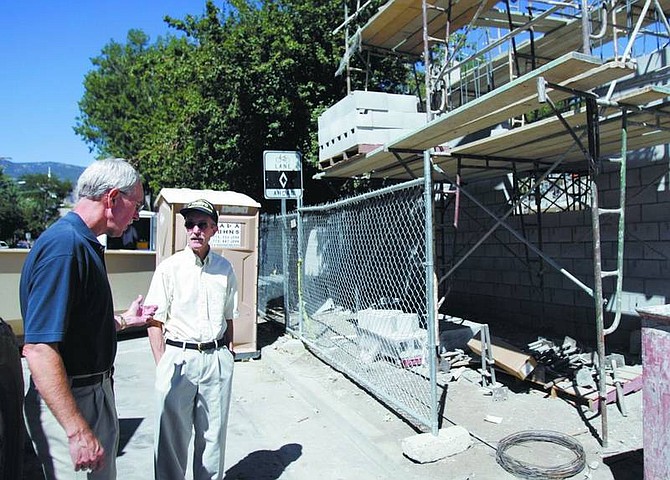 Chad Lundquist/Nevada Appeal Rev. Bruce Kochsmeier talks with Tom Streenan about the new sanctuary under construction at the First Presbyterian Church on Tuesday. Streenan is assisting the church in raising money by selling donated items on eBay, the money is going into a fund to help pay for the construction.