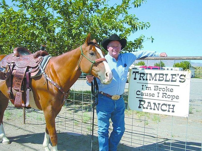 Mary Jean Kelso/Nevada Appeal News Service Billy &quot;Tee&quot; Trimble and his horse, Tuffy, stand alongside his property in Fernley. Trimble and his son-in-law partner each received $100,000, a leather-tooled saddle and a championship belt buckle for winning the World&#039;s Richest Roping Competition at the Reno Invitational Rodeo in 2006.