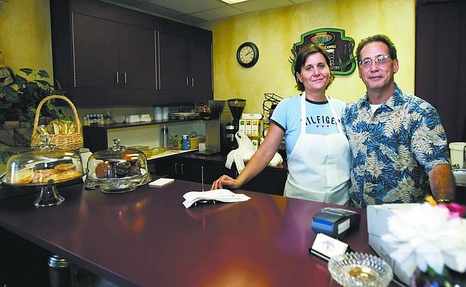 Chad Lundquist/Nevada Appeal Lou Lane, right, and his wife Joan-Marie, new owners of Joanie&#039;s Creekside Deli &amp; Catering, stand in their restaurant on Tuesday.
