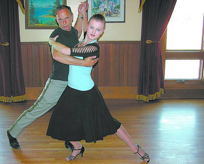 Andrew Pridgen/Nevada Appeal Sheriff Kenny Furlong and DeAnn Rife, 18, of Sparks, practice for Let&#039;s Dance Carson City, a fundraiser for the Carson Area Wellness Coalition, on Monday at the Brewery Arts Center Ballroom. The Competition begins 7 p.m. Saturday.