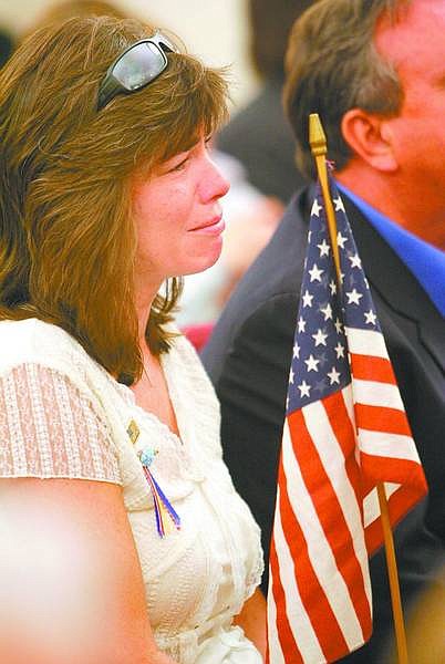 Cathleen Allison/Nevada Appeal Kate Morra listens to the &quot;Remembering 9/11 Day&quot; presentation at Capital Baptist Church on Tuesday night.