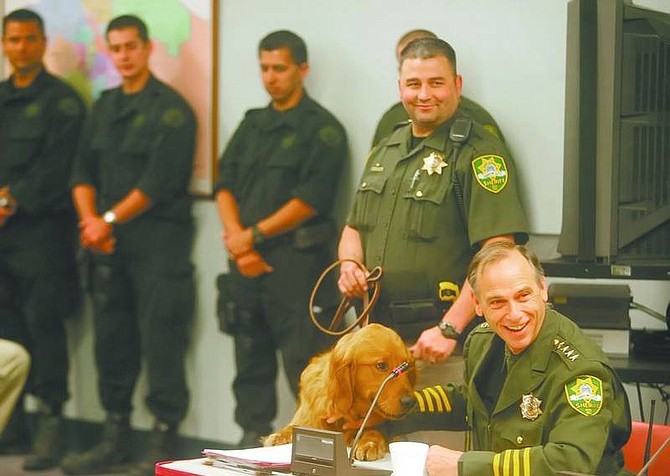 Nevada Appeal FILEPHOTO Carson City Sheriff Kenny Furlong introduces Teddy, the department&#039;s new drug dog, during a Board of Supervisors meeting at the Carson City Community Center in May. Pictured with leash is Teddy&#039;s handler, Deputy Dan Ochsenschlager.