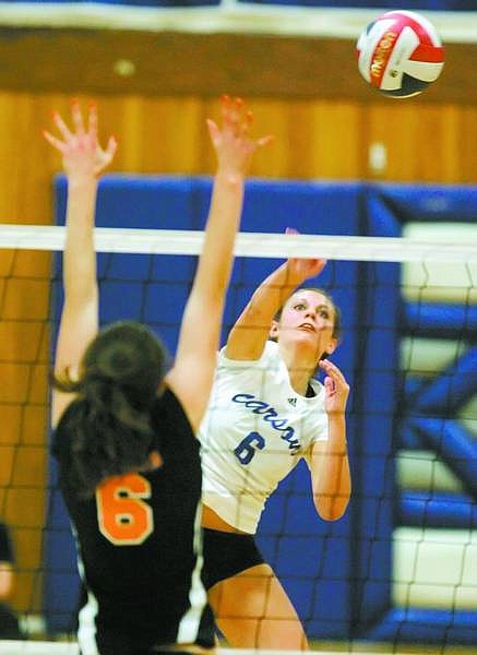 BRAD HORN/Nevada Appeal Carson&#039;s Danae Eckart hits against a Douglas defender during the Senator&#039;s match in Carson against the Tigers on Thursday.