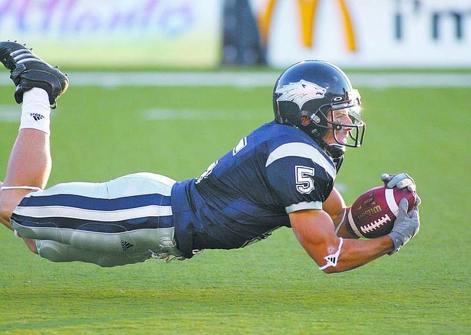 Nevada&#039;s Kyle Sammons tries to come up with a diving catch against Nicholls State, Saturday night, Sept. 15, 2007, in Reno, Nevada. (AP Photo/Nevada Appeal, Cathleen Allison)