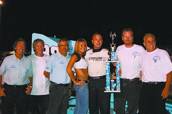 Rhonda Costa-Landers/NevadaAppealS&amp;S Motorsports shows off their trophy for winning the 36th annual Harvest Classic at Madera Speedway Saturday in Madera, Calif. Regier&#039;s win qualifies him for the fifth annual North-South Supermodified Shootout in Concord, N.C., in November. Pictured with the trophy girl (center) are, from left, Ed Silsby, Tom Silsby, Rick Barba, driver Troy Regier, John Stewart and Steve Shaw.