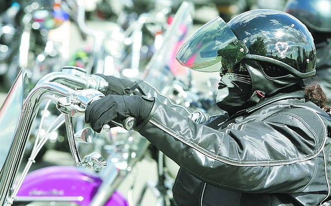 photos by BRAD HORN/Nevada Appeal Elvia Moreno, of Santa Cruz, Calif., waits for her group of riders to depart the Harley-Davidson dealership in Carson City on Thursday.