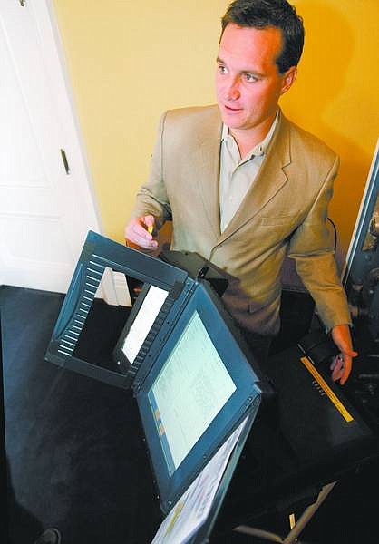 Cathleen Allison/Nevada Appeal  Secretary of State Ross Miller talks Thursday about voting machines from his office at the Capitol.