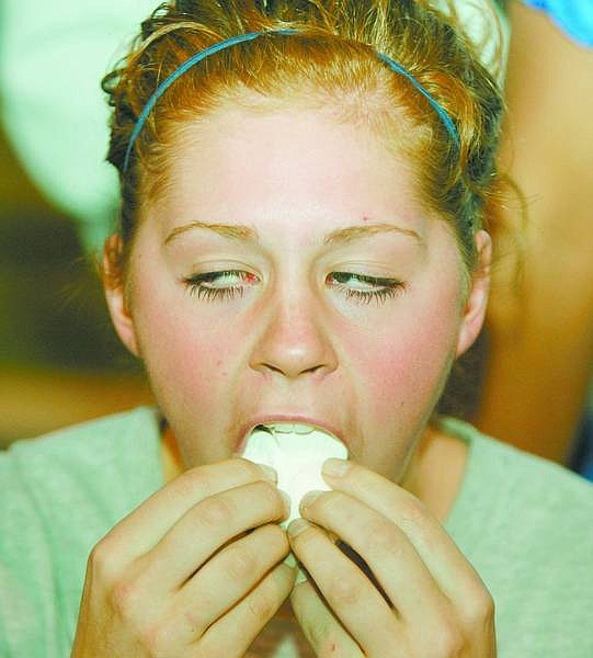 BRAD HORN/Nevada Appeal Carson HIgh School volleyball standout Blake King competes in the marshmallow eating contest on the football field after the homecoming parade on Wednesday.