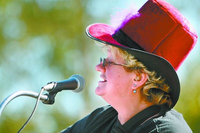 Jen Schmidt/Nevada Appeal Gretchen Wood, a longtime resident of  Silver Springs, was grand marshal for the town&#039;s Founder&#039;s Day parade Saturday. She was honored for her years of service to the community. Here, she sings and plays guitar as part of the duo Old and Dirty on Sunday.