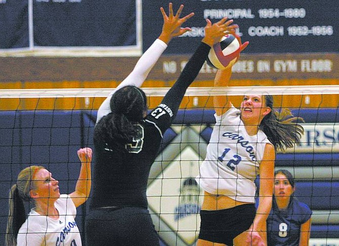 Trevor Clark/Nevada AppealCarson High School Varsity Girls Volleyball team member Nikki Keller gets blocked by Damonte Ranch&#039;s Chaiymin Steel during the Senators&#039; 3-2 loss to the Mustangs at CHS on Tuesday night.