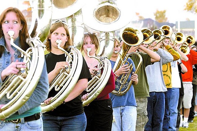 Shannon Litz/Nevada Appeal NEws Service Tuba players, Katie Nicholson, Katharine Eshelman and Brandi Graves, practice for the field show competition at Douglas High School on Wednesday.