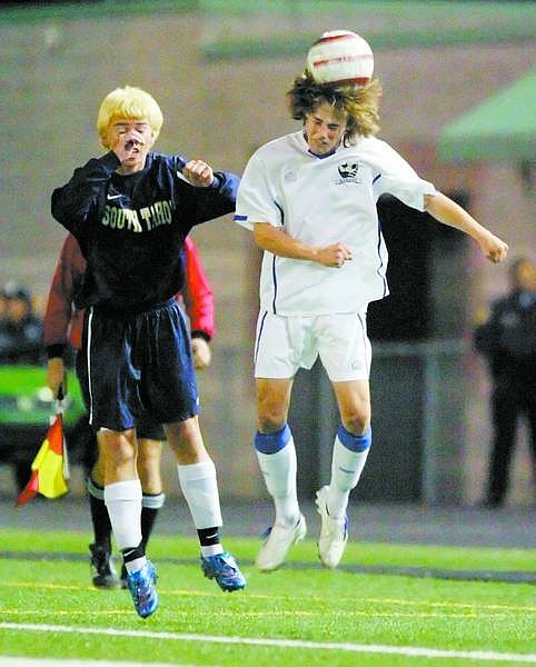 BRAD HORN/Nevada Appeal Carson&#039;s Nikolaus Marsh heads the ball during their semi-final playoff game in the NIAA soccer tournament on Thursday.