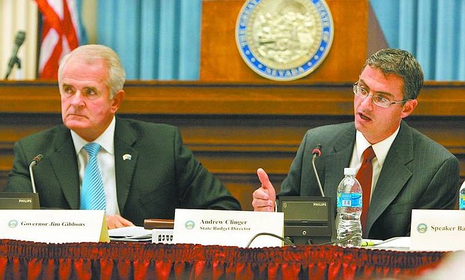 Cathleen Allison/Nevada Appeal Gov. Jim Gibbons and Budget Director Andrew Clinger answer questions Wednesday during a meeting at the Capitol with state leaders.