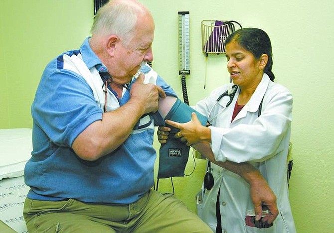 Cathleen Allison/Nevada Appeal Dr. Umasankari Sundaram checks Walter Piurek&#039;s blood pressure Wednesday at the Lahontan Medical Complex in Silver Springs.