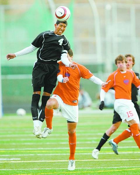 BRAD HORN/Nevada Appeal Douglas (No. 4) controls the ball for the Tigers in their Nevada State Championship game against Bishop Gorman at Damonte Ranch on Saturday.