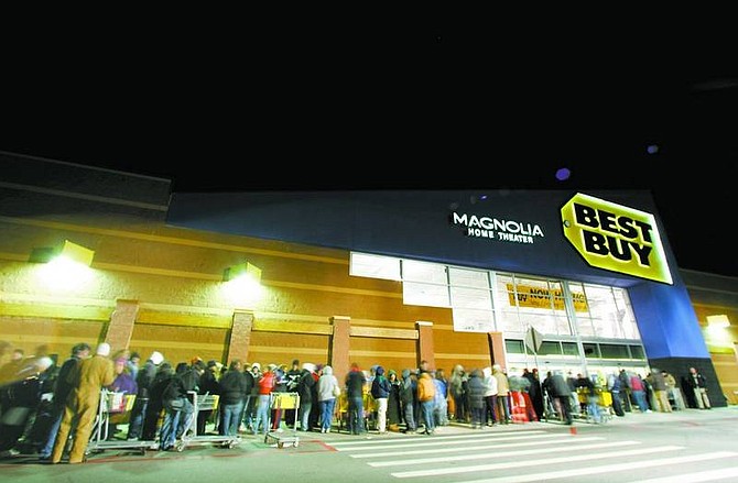 BRAD HORN/Nevada Appeal Black Friday shoppers line up in front of Best Buy at 4:15 a.m. Friday in hope of grabbing some of the doorbuster deals offered when the store opened at 5 a.m. A Dynex 32-inch, flat-panel LCD HDTV was offered to the first 20 customers for $449.99, a $300 discount.
