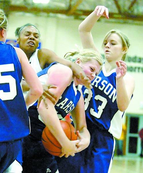 BRAD HORN/Nevada Appeal Carson&#039;s Natalie Morrow, center, tries to control the ball against Centenial while Carson&#039;s Tiffany O&#039;Day assists at Carson Middle School on Friday.