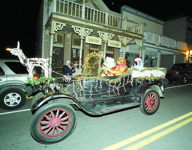 BRAD HORN/Nevada Appeal Beauregard drives Santa Claus in a Model T during the &quot;Parade of Lights&quot; celebration in Virginia City on Saturday.